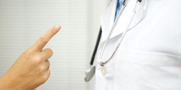 Someone wagging their finger at a physician