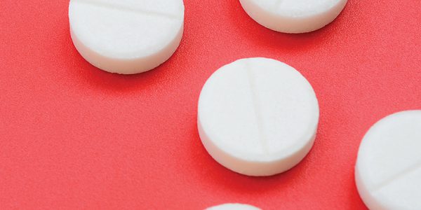 Close-up of small, white prescription pills