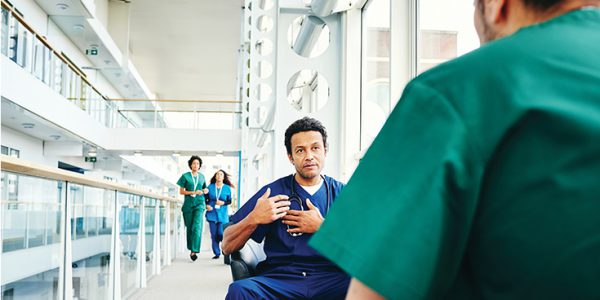 Doctors having a discussion in a hallway