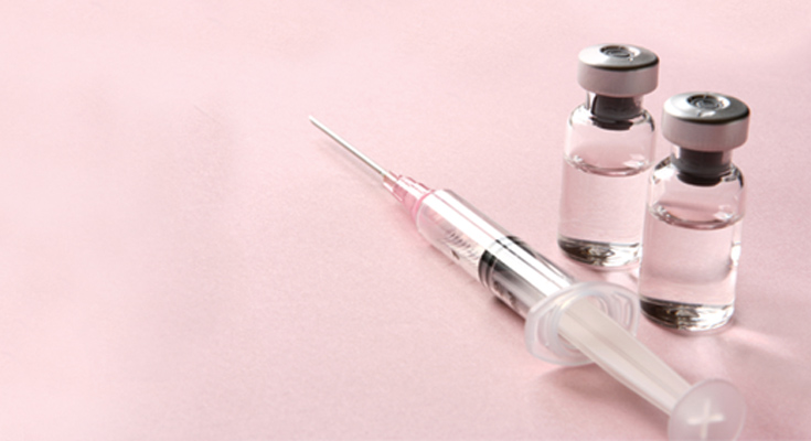 Syringe and two vials of serum
