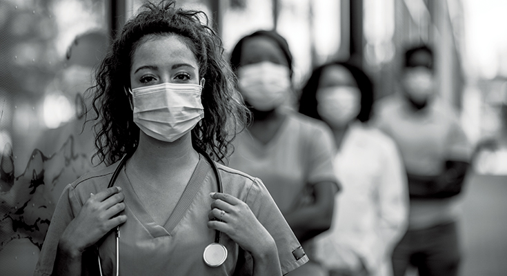 Black-and-white photo of healthcare workers wearing masks