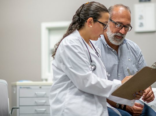Physician speaking to a patient