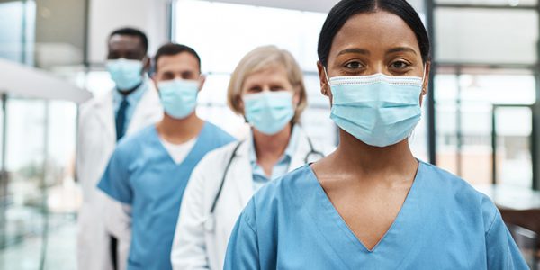 Healthcare workers in personal protective masks