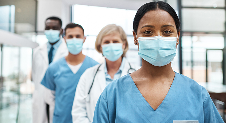 Healthcare workers in personal protective masks