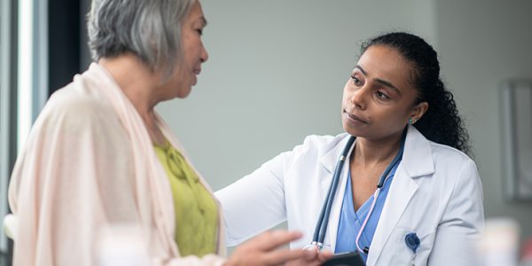 A physician consults a patient