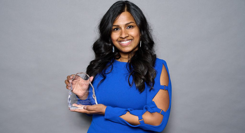 Dr. Sundareswaran holds her CPSO Board Award.